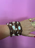 MAGNIFICO - Bracciale multifili - 7 file - perle brown e bianche coltivate barocche e piatte e topazio fumè