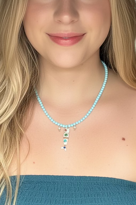 Collana POISSONS - turchese mm 4 - chiusura argento 925 -  3 pesciolini