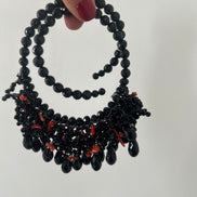 INCANTEVOLE -   MEDITERRANEA Chocker flessibile onic con cascata cristalli neri swarovski e corallo