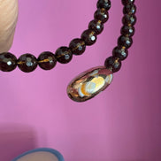 INCANTEVOLE -  Chocker flessibile contrarié  topazio fumé (cm1,2) sfaccettato con terminali ovali dorati agata naturale