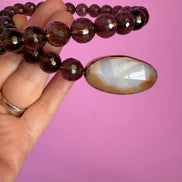 INCANTEVOLE -  Chocker flessibile contrarié  topazio fumé (cm1,2) sfaccettato con terminali ovali lunghi agata