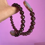INCANTEVOLE -  Chocker flessibile contrarié  topazio fumé (cm1,2) sfaccettato con terminali ovali lunghi agata