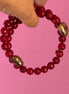 INCANTEVOLE -  Chocker flessibile contrarié  giada ruby sfaccettata con  terminali dorati Agata