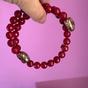 INCANTEVOLE -  Chocker flessibile contrarié  giada ruby sfaccettata con  terminali dorati Agata