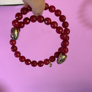 INCANTEVOLE -  Chocker flessibile contrarié  giada ruby sfaccettata con  terminali dorati Agata