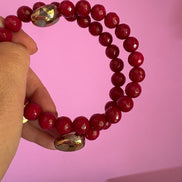 INCANTEVOLE -  Chocker flessibile contrarié  giada ruby sfaccettata con  terminali dorati Agata