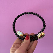 INCANTEVOLE -  Chocker flessibile contrarié  onice con terminali inserti dorati