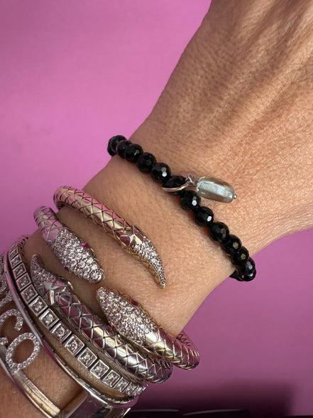 BISETTE - Bracciale sfere onice cm0,6 e charm topazio azzurro