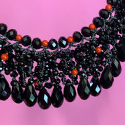 INCANTEVOLE -   MEDITERRANEA Chocker flessibile onic con cascata cristalli neri swarovski e corallo