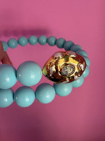 INCANTEVOLE -  OCEANO Chocker flessibile turchese contrarié con terminali gold