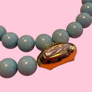 INCANTEVOLE -  OCEANO Chocker flessibile turchese 1.2 contrarié con terminali gold perle