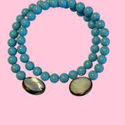 INCANTEVOLE -  OCEANO Chocker flessibile contrarié  turchese  0,8 con terminali madreperla