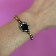Braccialetto  Bisette ematite oro con onice