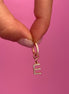 Monorecchino lettere e zirconi oro rosa