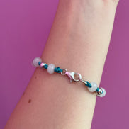 NODINI - Bracciale con cordino azzurro e zirconi