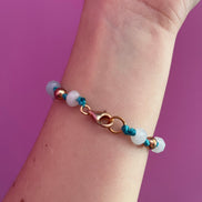 NODINI - Bracciale con cordino azzurro e corona