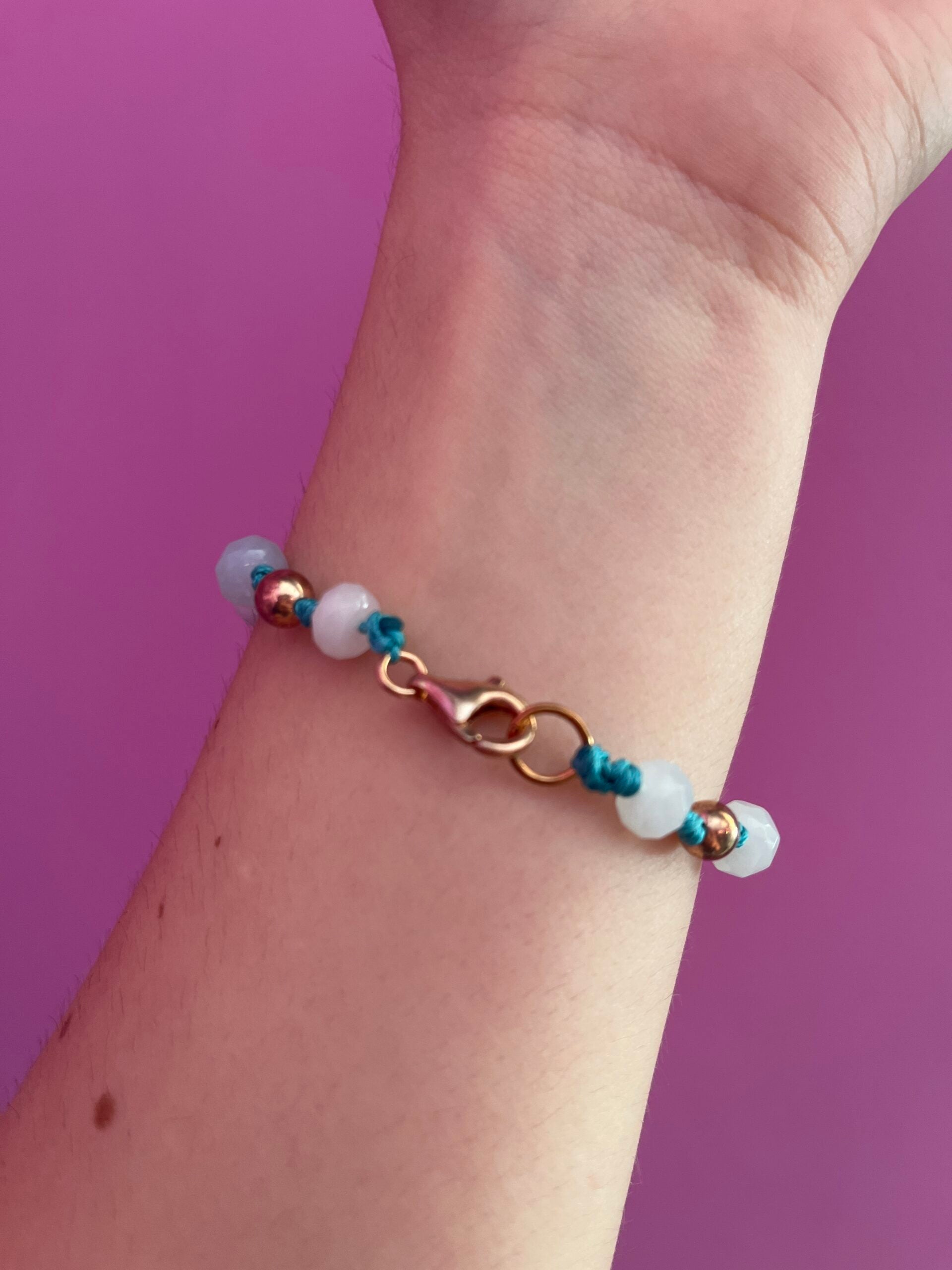 NODINI - Bracciale con cordino azzurro e corona