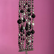 MAGNIFICO Bracciale multifili - 7 file - onice e perle coltivate grigie